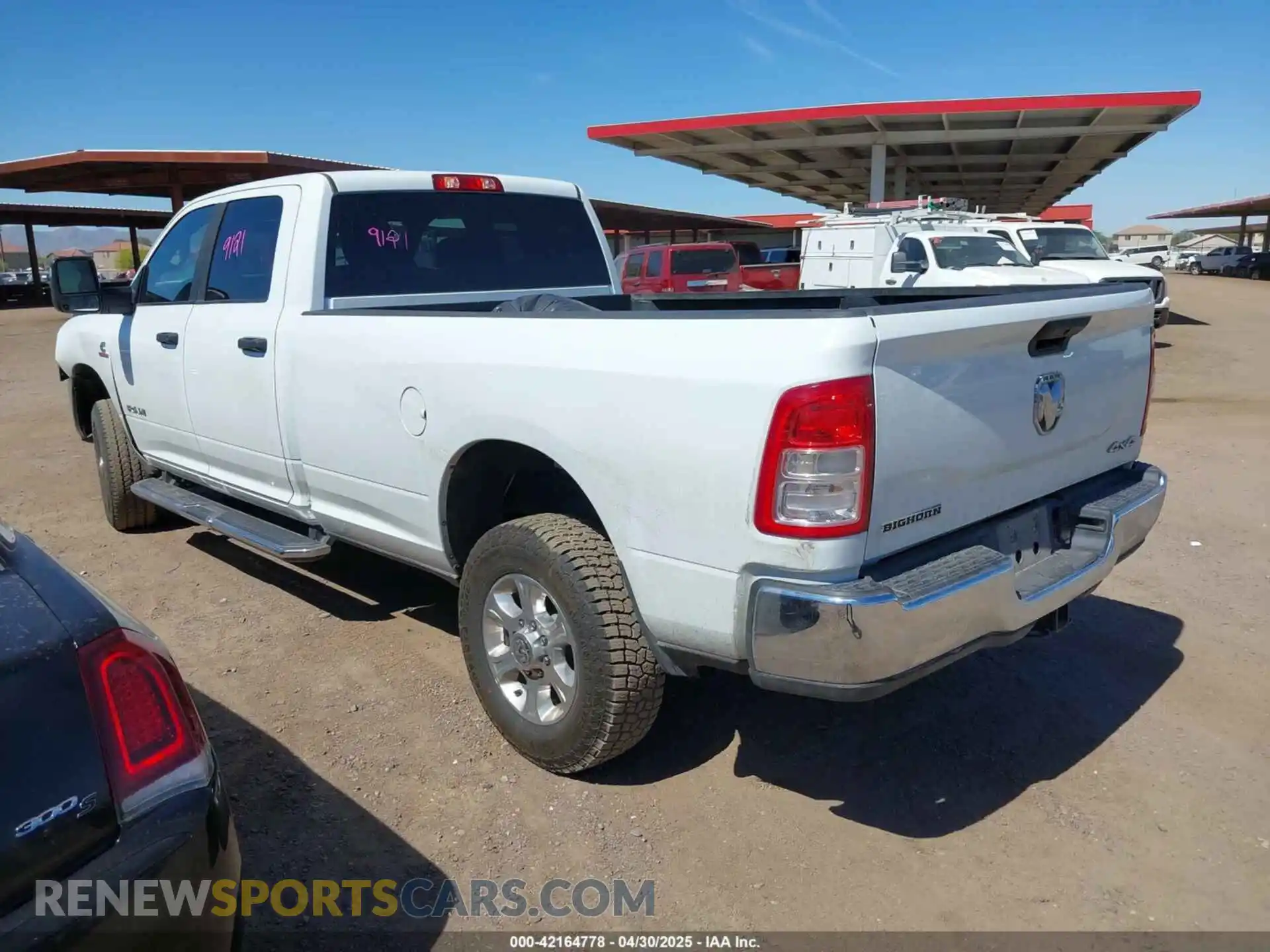 3 Photograph of a damaged car 3C6UR5JL2RG337668 RAM 2500 2024