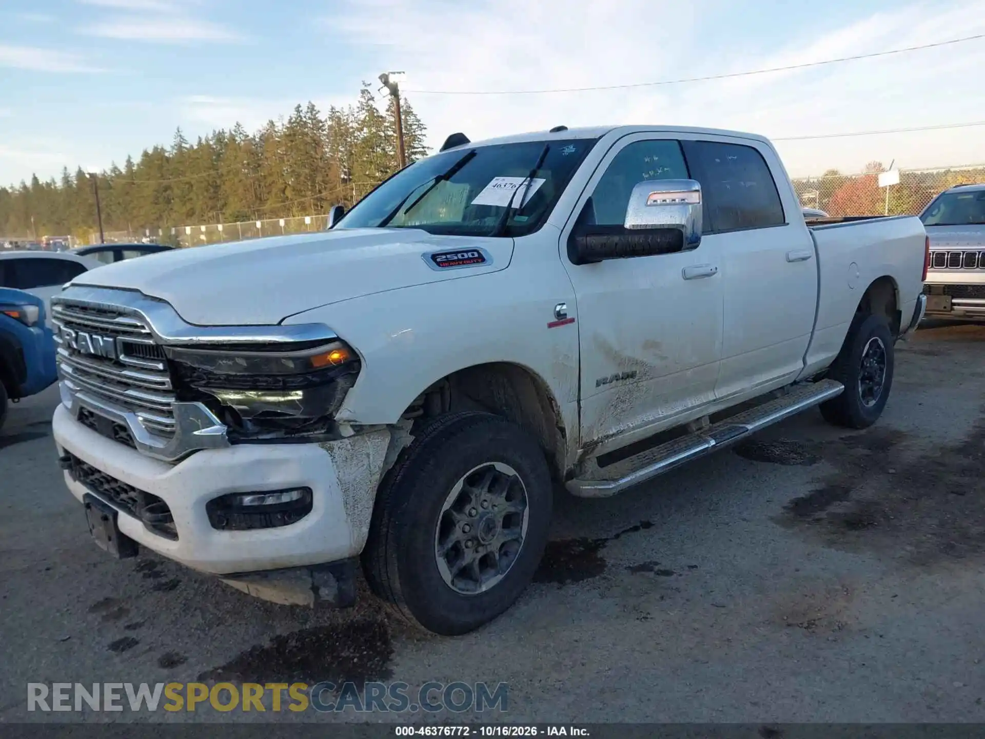 2 Photograph of a damaged car 3C6UR5FL4TG274279 RAM 2500 2026