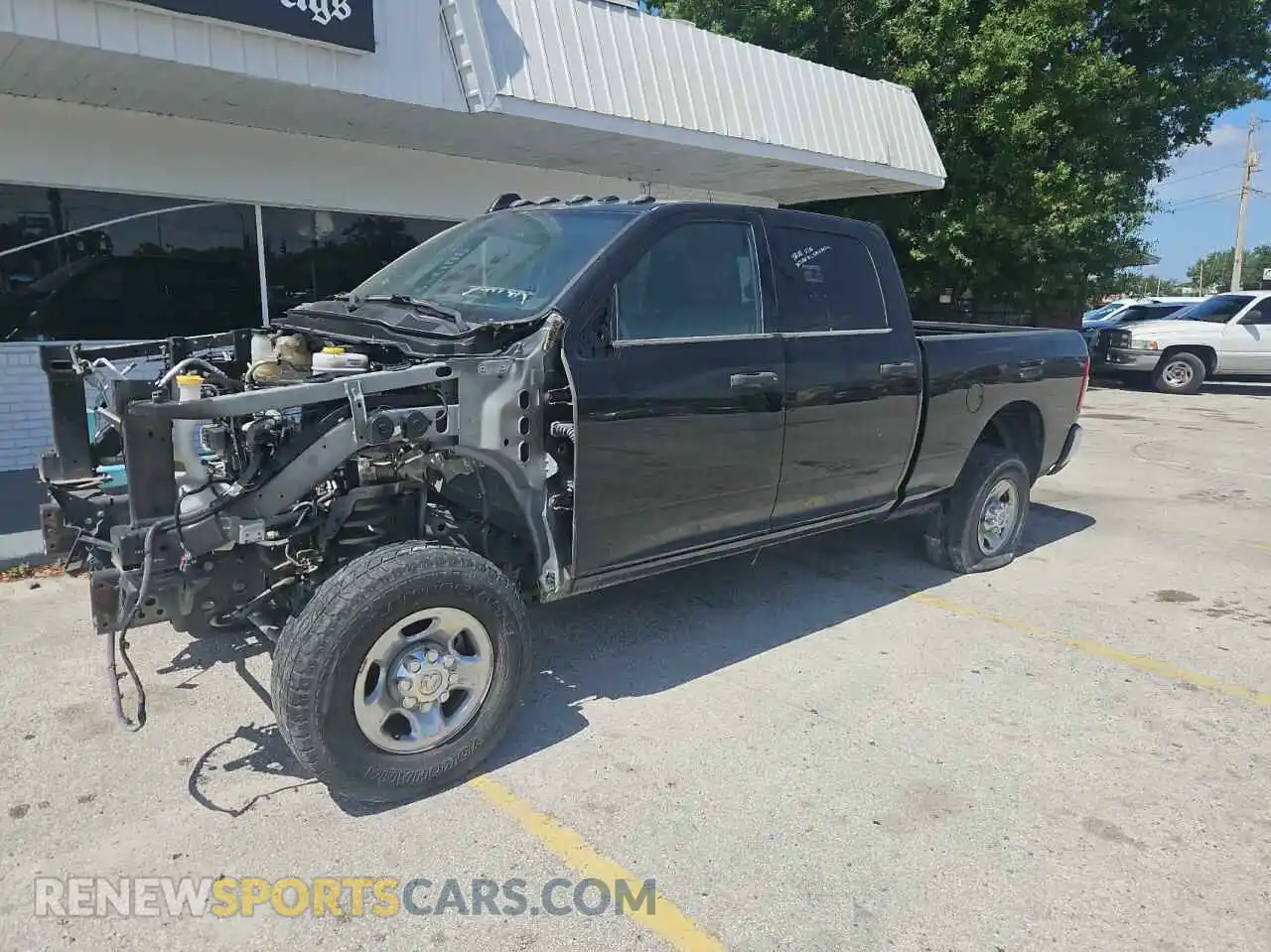 2 Photograph of a damaged car 3C63R3CL5PG542346 RAM 3500 2023