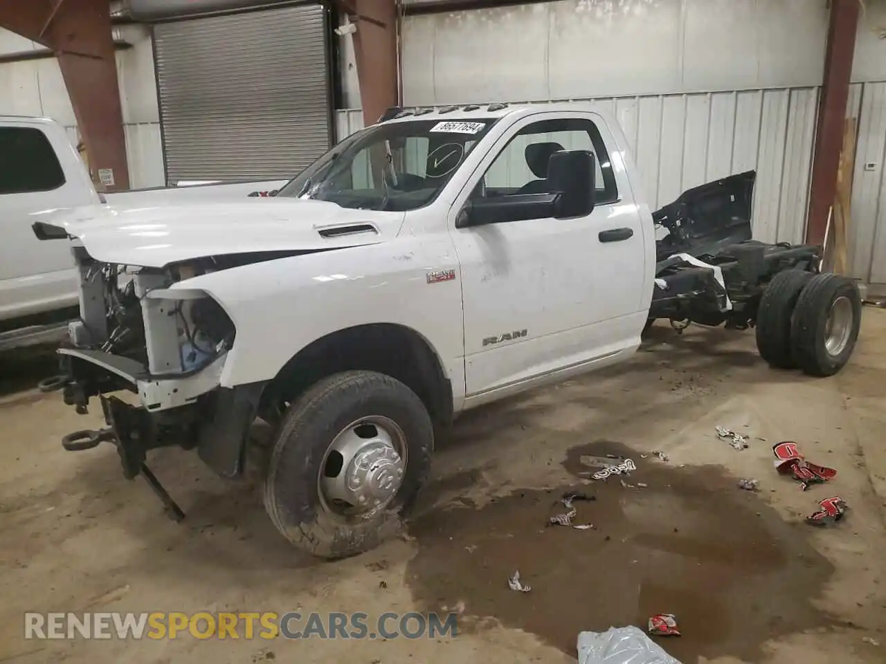 1 Photograph of a damaged car 3C7WRSBJ7NG200011 RAM All Models 2022
