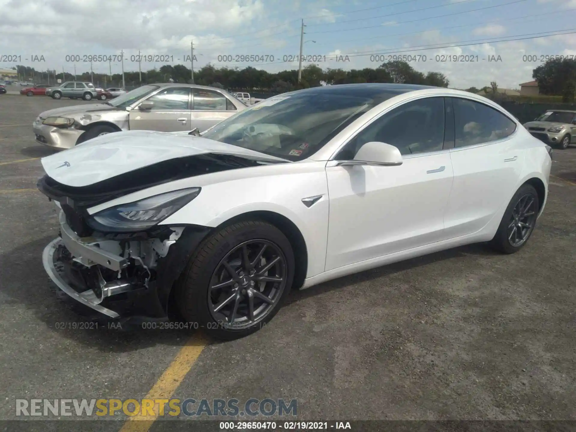 2 Photograph of a damaged car 5YJ3E1EB0LF639497 TESLA MODEL 3 2020