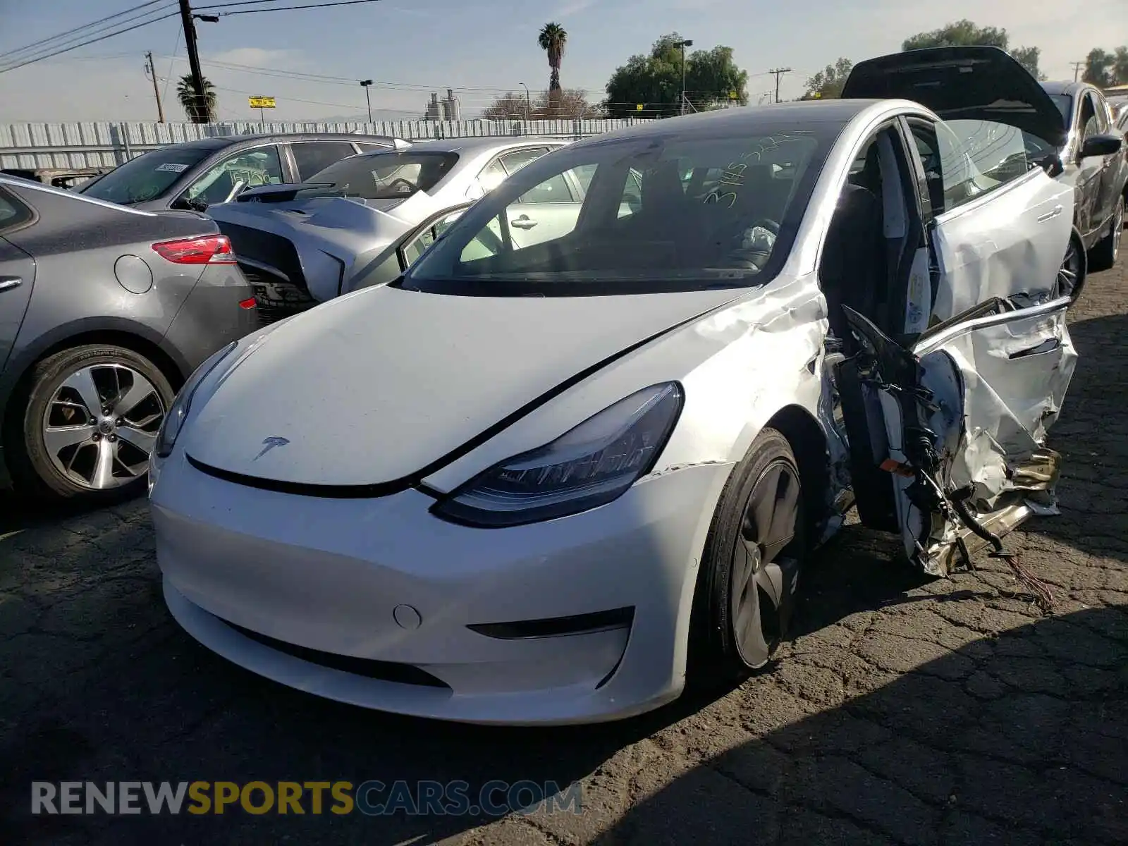 2 Photograph of a damaged car 5YJ3E1EB6LF618394 TESLA MODEL 3 2020