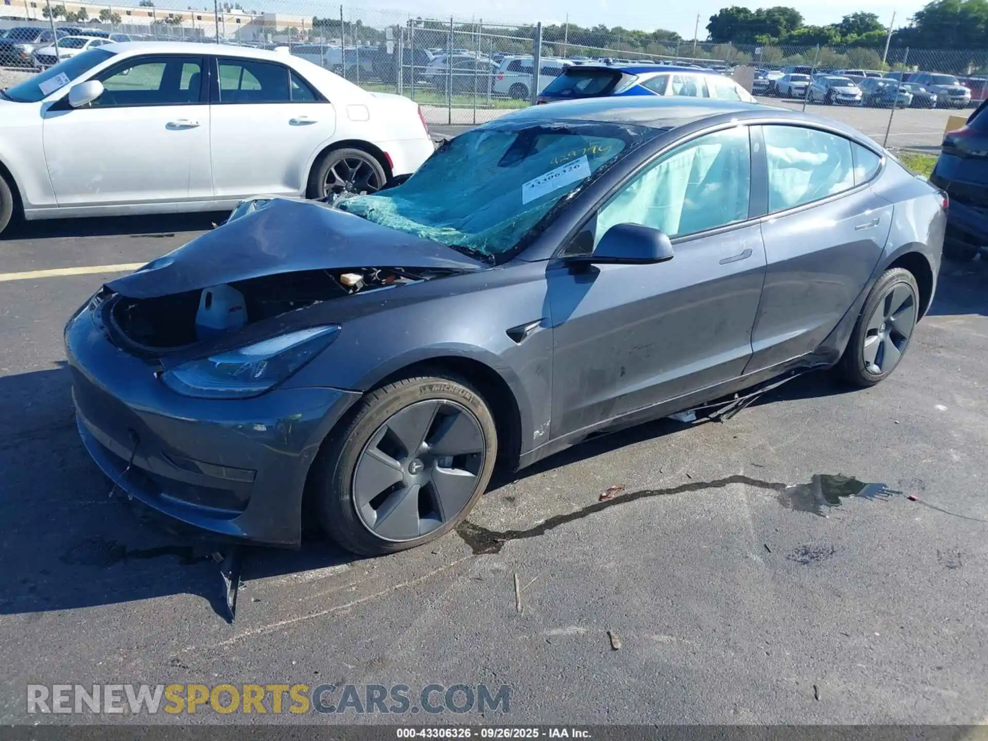 2 Photograph of a damaged car 5YJ3E1EA0MF058879 TESLA MODEL 3 2021