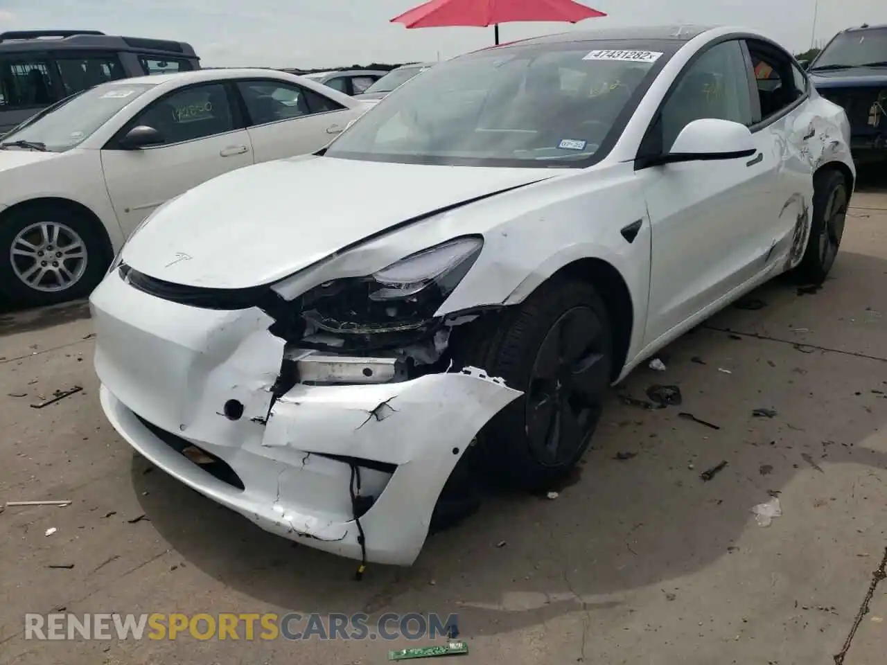 2 fotografías del automóvil dañado 5YJ3E1EA0MF976874 TESLA MODEL 3 2021