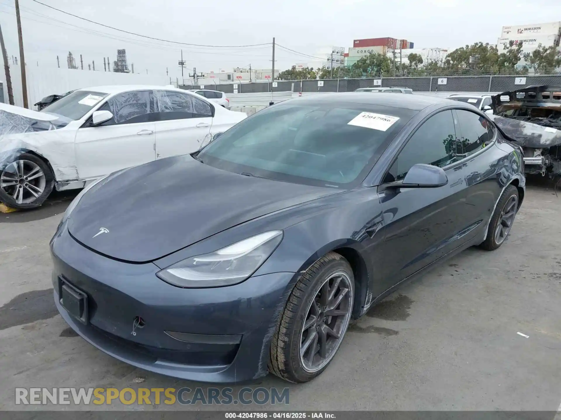 2 fotografías del automóvil dañado 5YJ3E1EA1MF068787 TESLA MODEL 3 2021