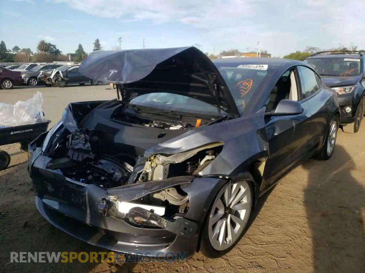 2 fotografías del automóvil dañado 5YJ3E1EA2MF001406 TESLA MODEL 3 2021