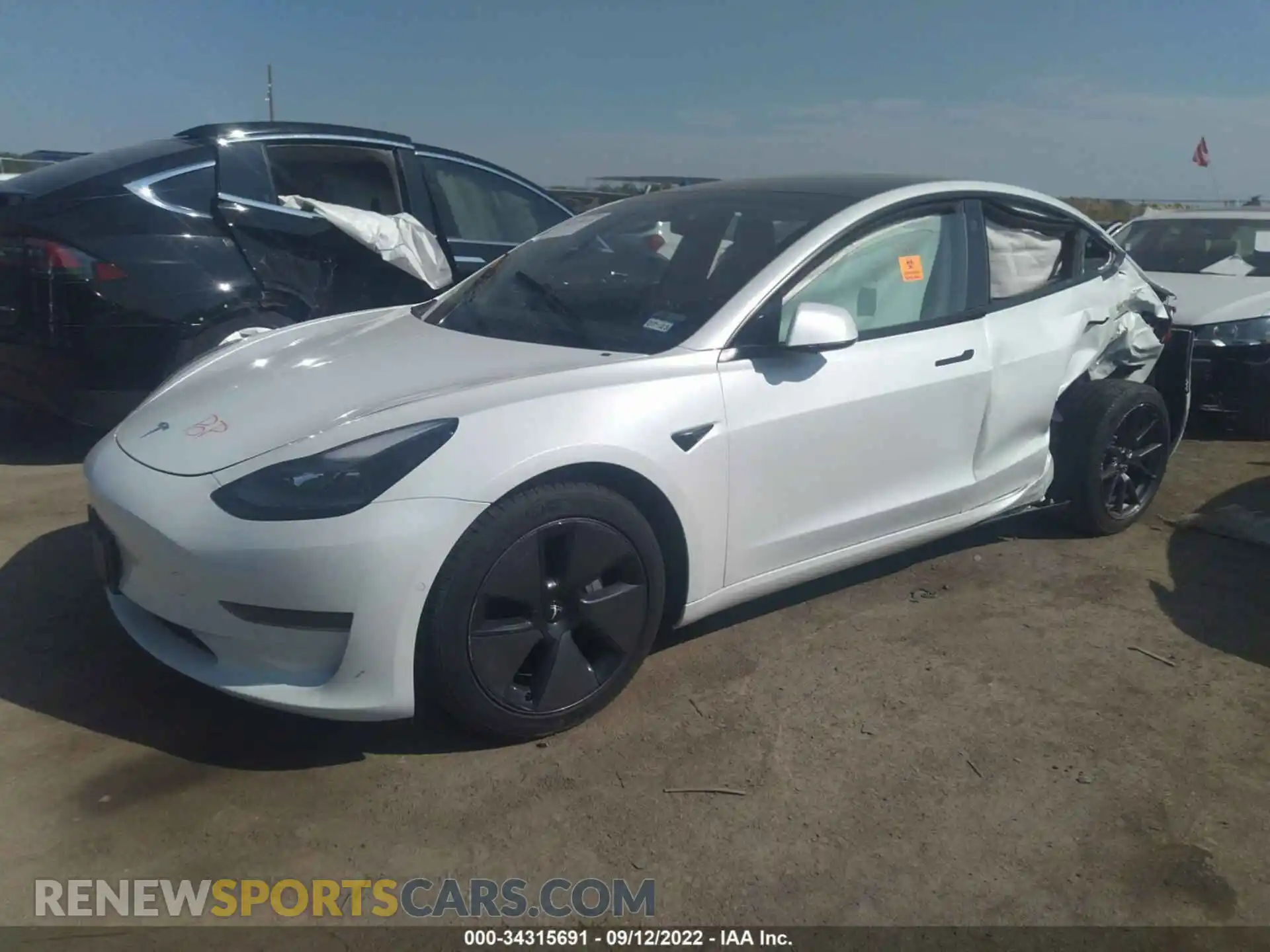 2 Photograph of a damaged car 5YJ3E1EA3MF989022 TESLA MODEL 3 2021