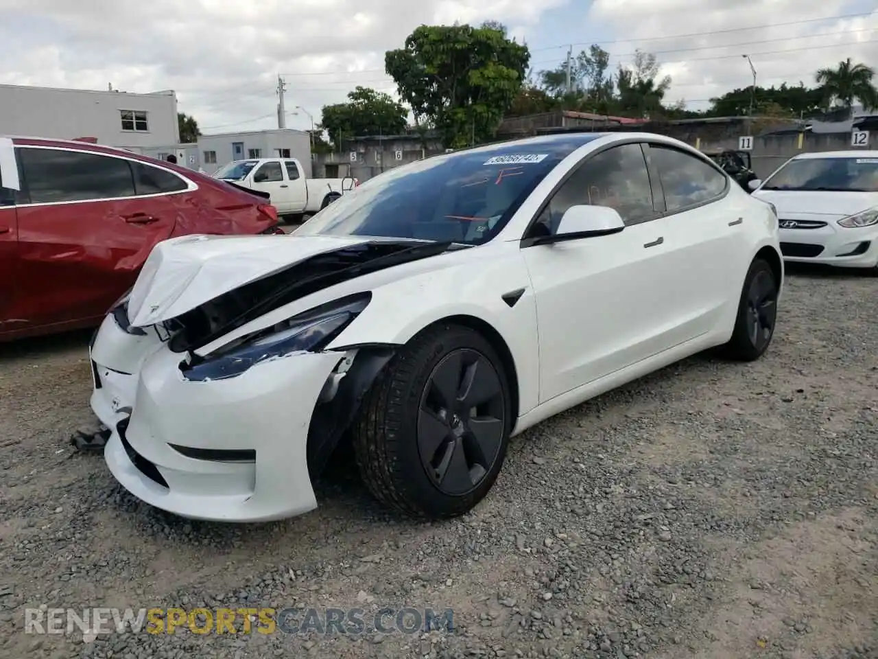 2 Photograph of a damaged car 5YJ3E1EA4MF989658 TESLA MODEL 3 2021