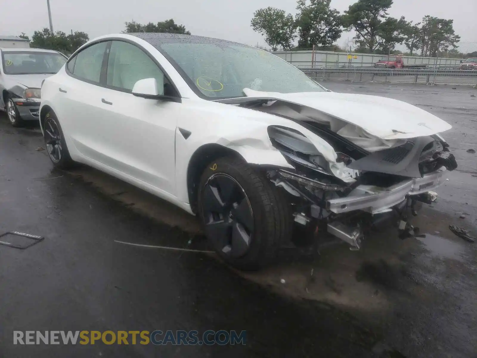 1 Photograph of a damaged car 5YJ3E1EA4MF989823 TESLA MODEL 3 2021