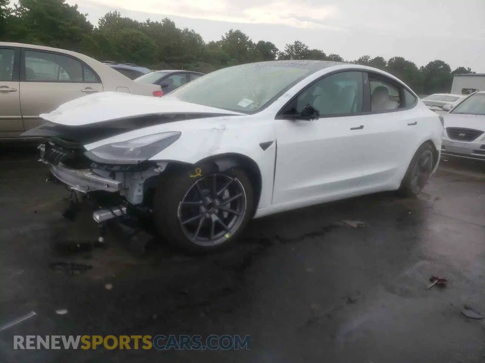 2 Photograph of a damaged car 5YJ3E1EA4MF989823 TESLA MODEL 3 2021