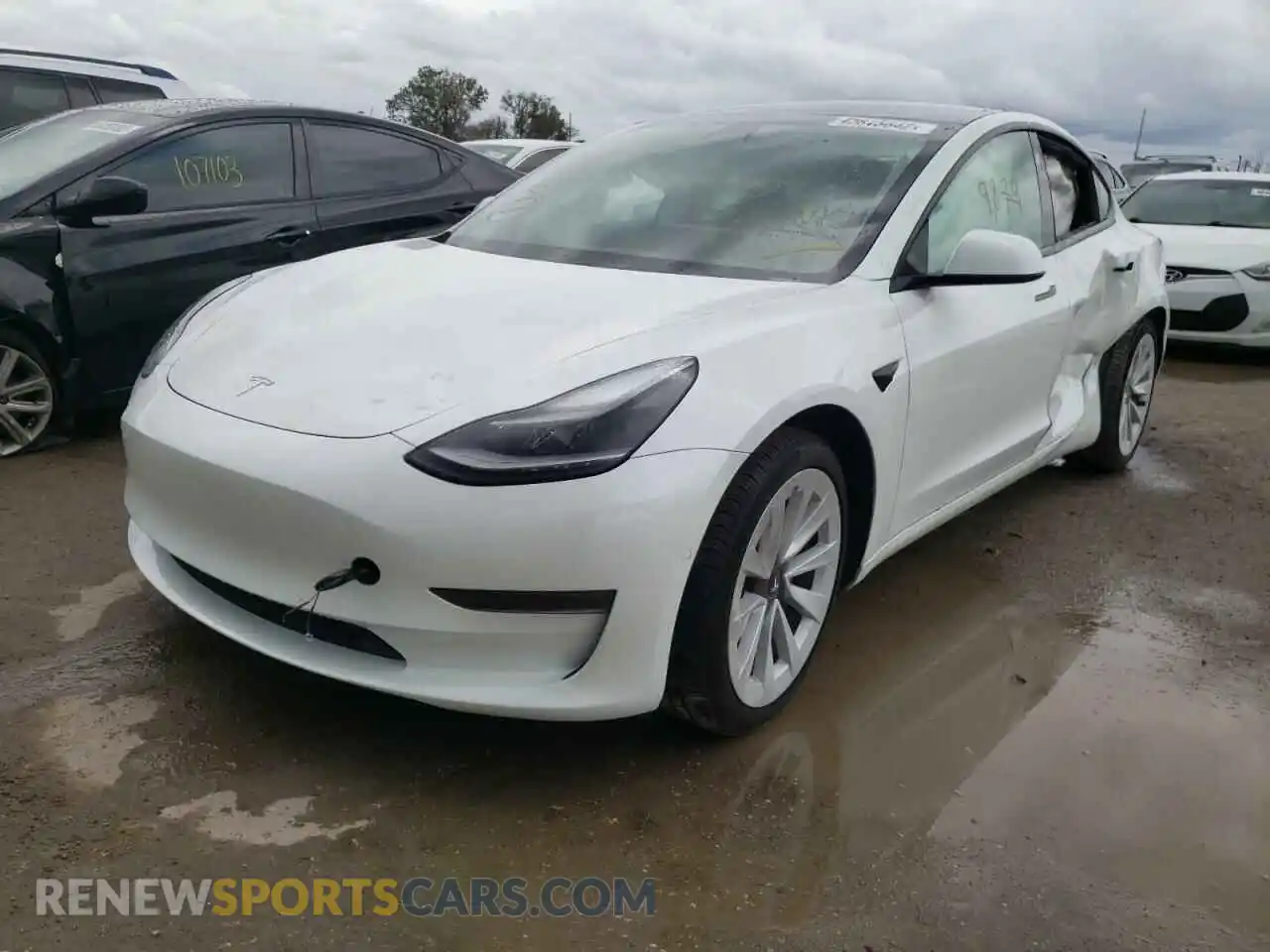 2 Photograph of a damaged car 5YJ3E1EA5MF990852 TESLA MODEL 3 2021