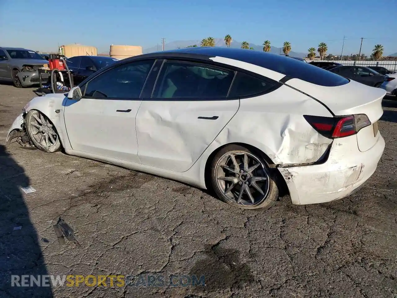 2 fotografías del automóvil dañado 5YJ3E1EA9MF994290 TESLA MODEL 3 2021