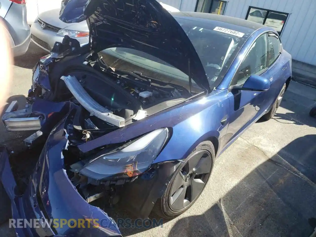2 Photograph of a damaged car 5YJ3E1EB1MF876887 TESLA MODEL 3 2021