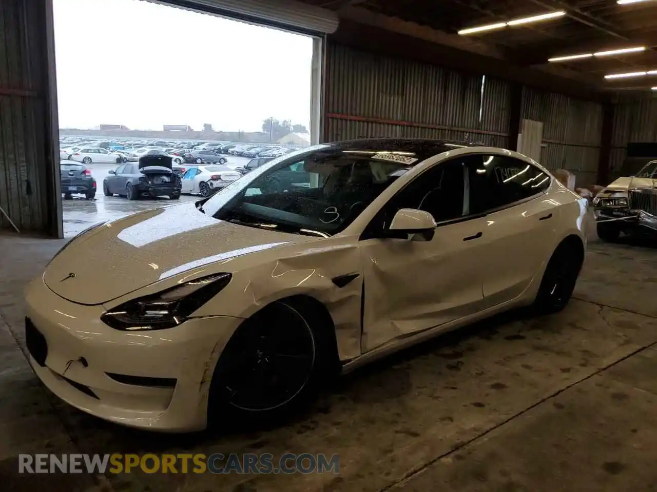 2 fotografías del automóvil dañado 5YJ3E1EA4NF167525 TESLA MODEL 3 2022