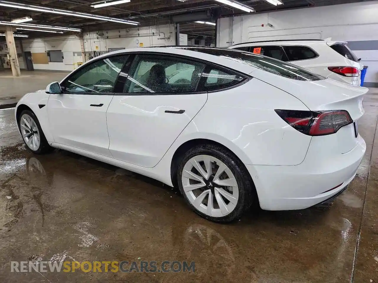 2 Photograph of a damaged car 5YJ3E1EA4NF304799 TESLA MODEL 3 2022