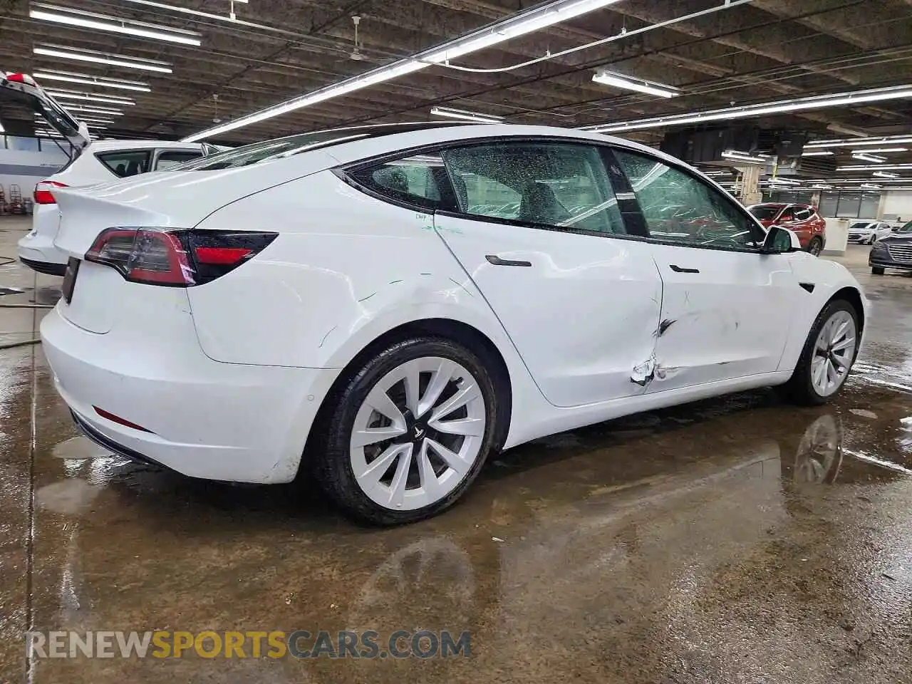 3 Photograph of a damaged car 5YJ3E1EA4NF304799 TESLA MODEL 3 2022