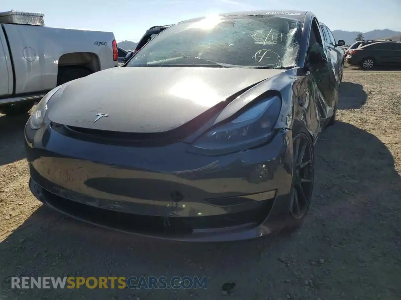 2 fotografías del automóvil dañado 5YJ3E1EB1NF206614 TESLA MODEL 3 2022