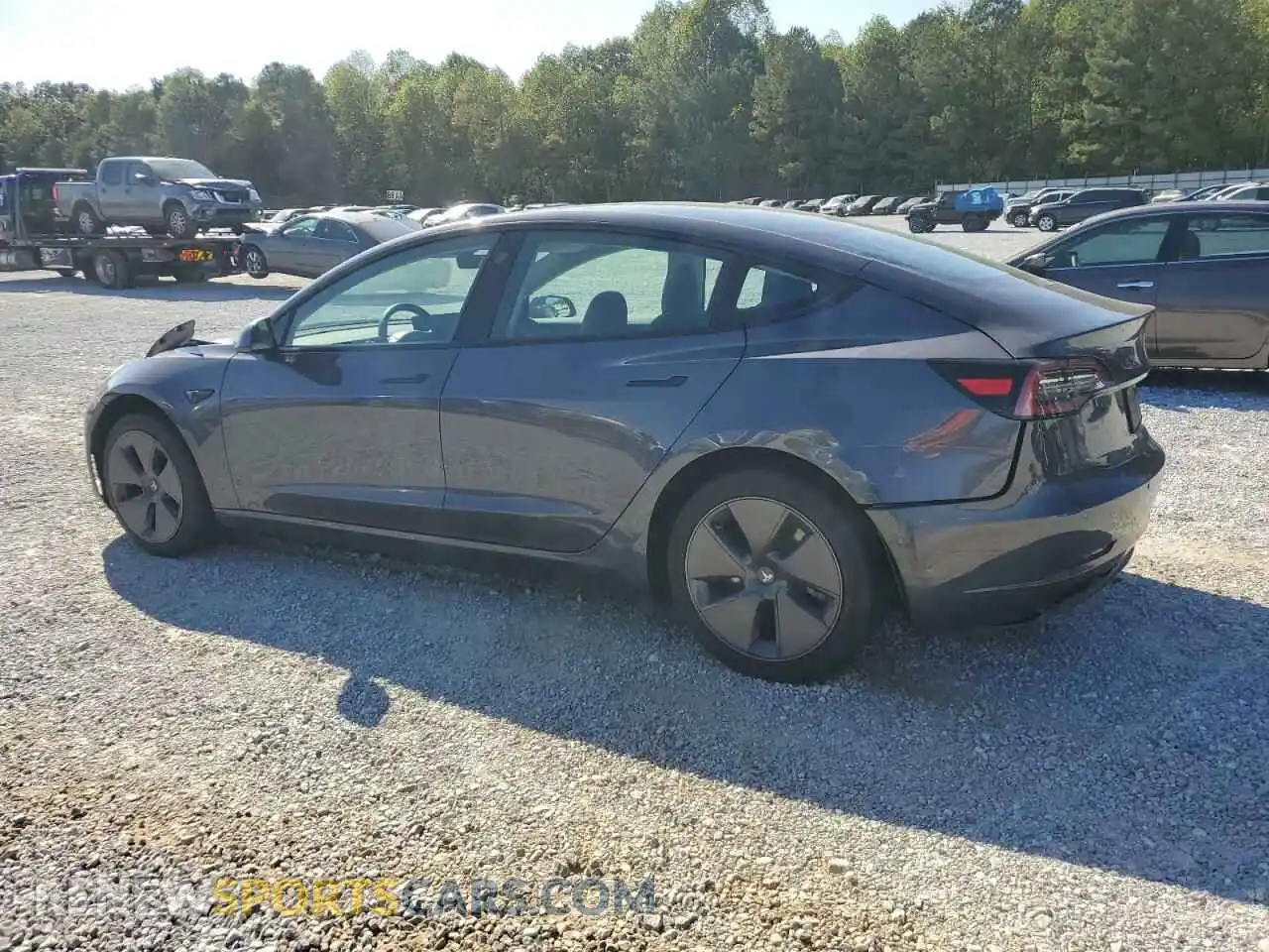2 fotografías del automóvil dañado 5YJ3E1EB3NF345885 TESLA MODEL 3 2022