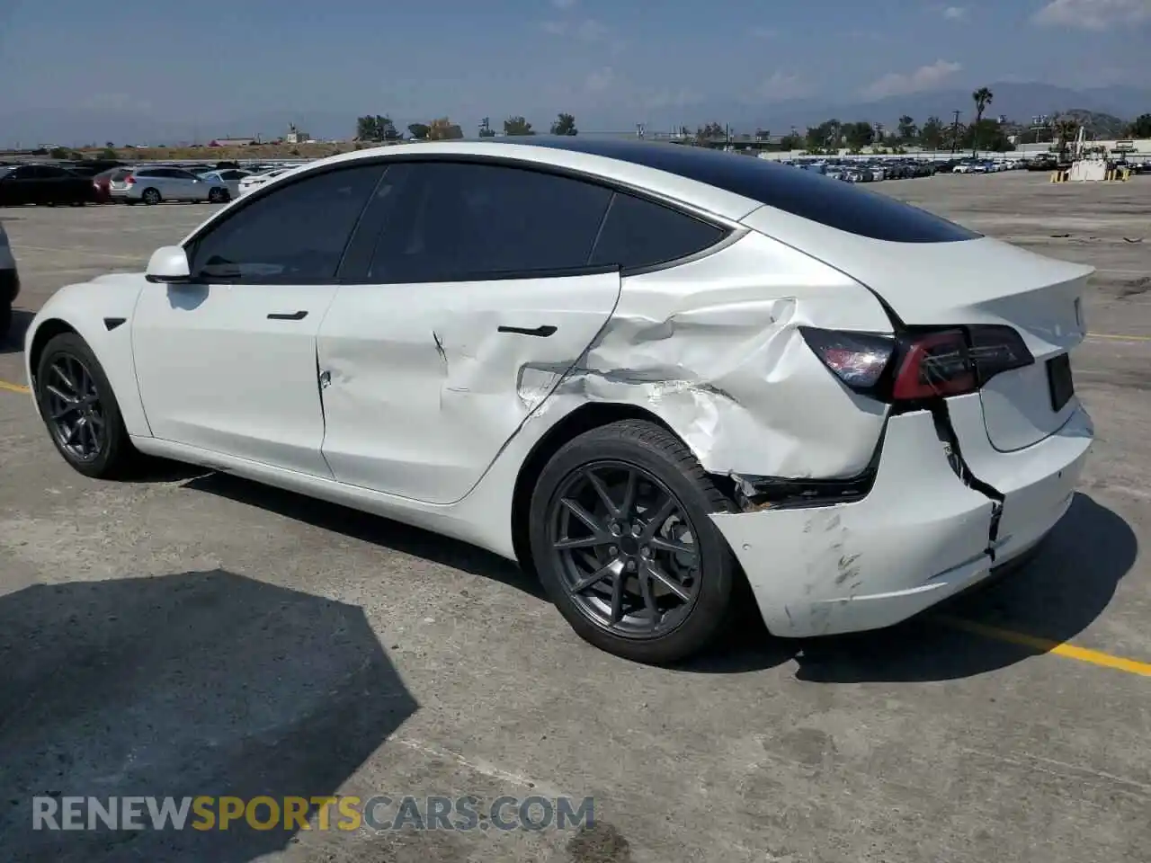 2 Photograph of a damaged car 5YJ3E1EB4NF332403 TESLA MODEL 3 2022