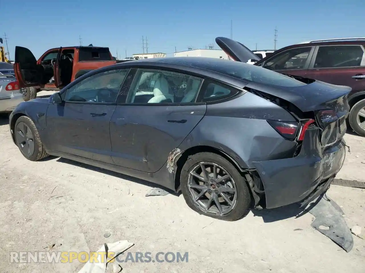 2 fotografías del automóvil dañado 5YJ3E1EB7NF322576 TESLA MODEL 3 2022