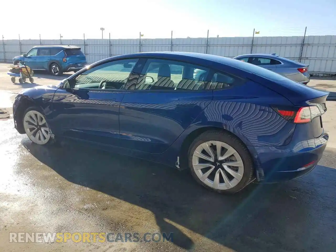 2 fotografías del automóvil dañado 5YJ3E1EB8NF301011 TESLA MODEL 3 2022