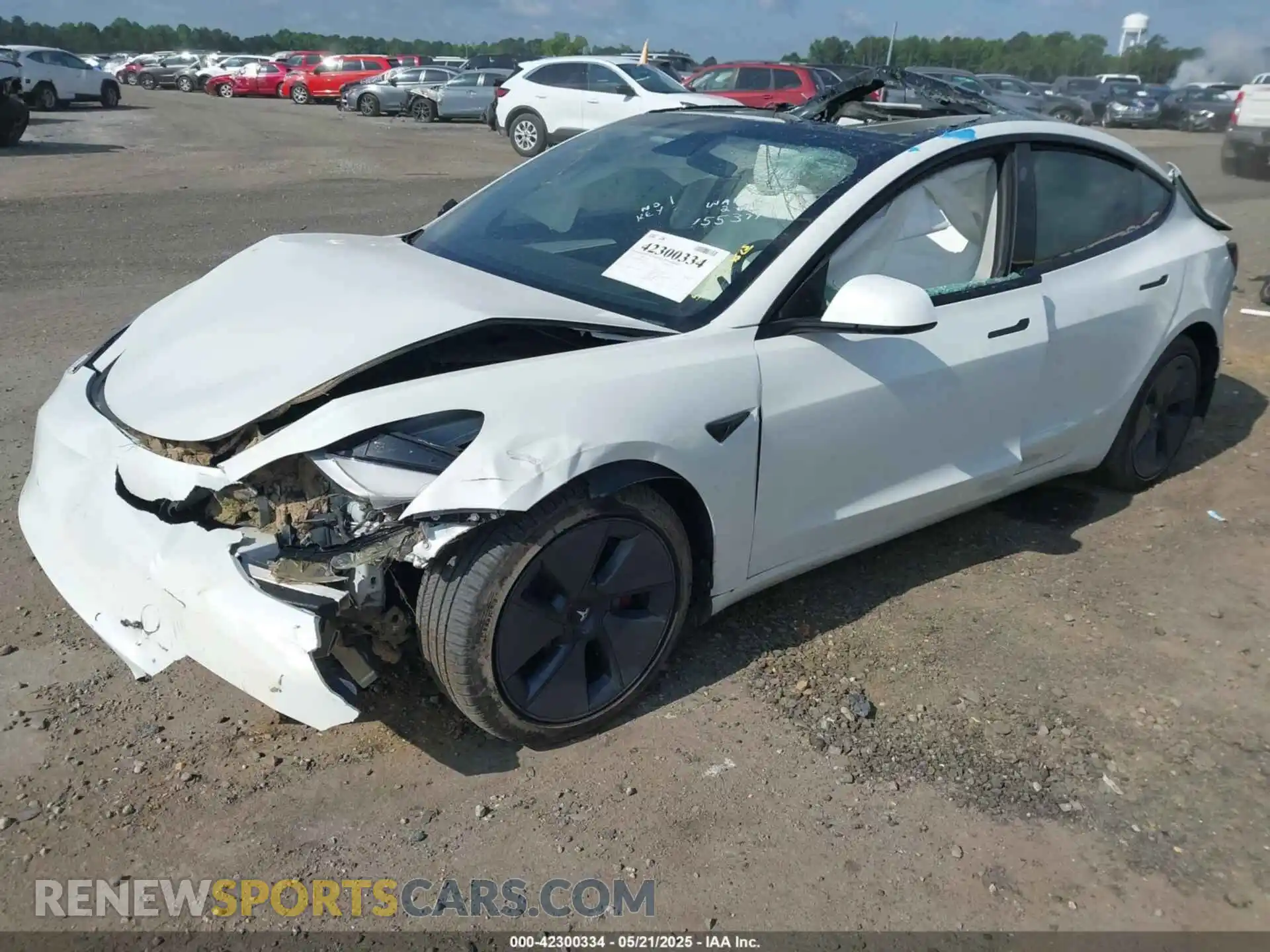 2 Photograph of a damaged car 5YJ3E1EB9NF155394 TESLA MODEL 3 2022