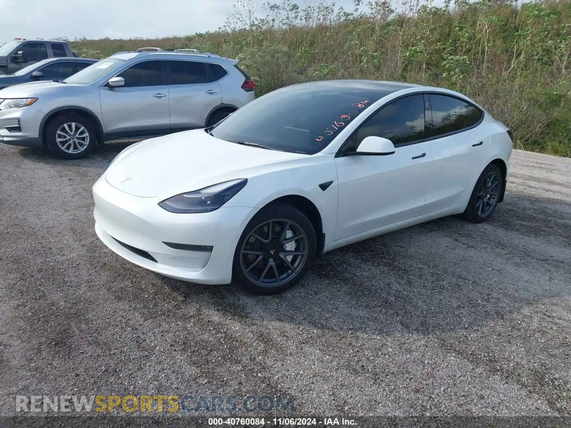 2 Photograph of a damaged car 5YJ3E1EB9NF310011 TESLA MODEL 3 2022