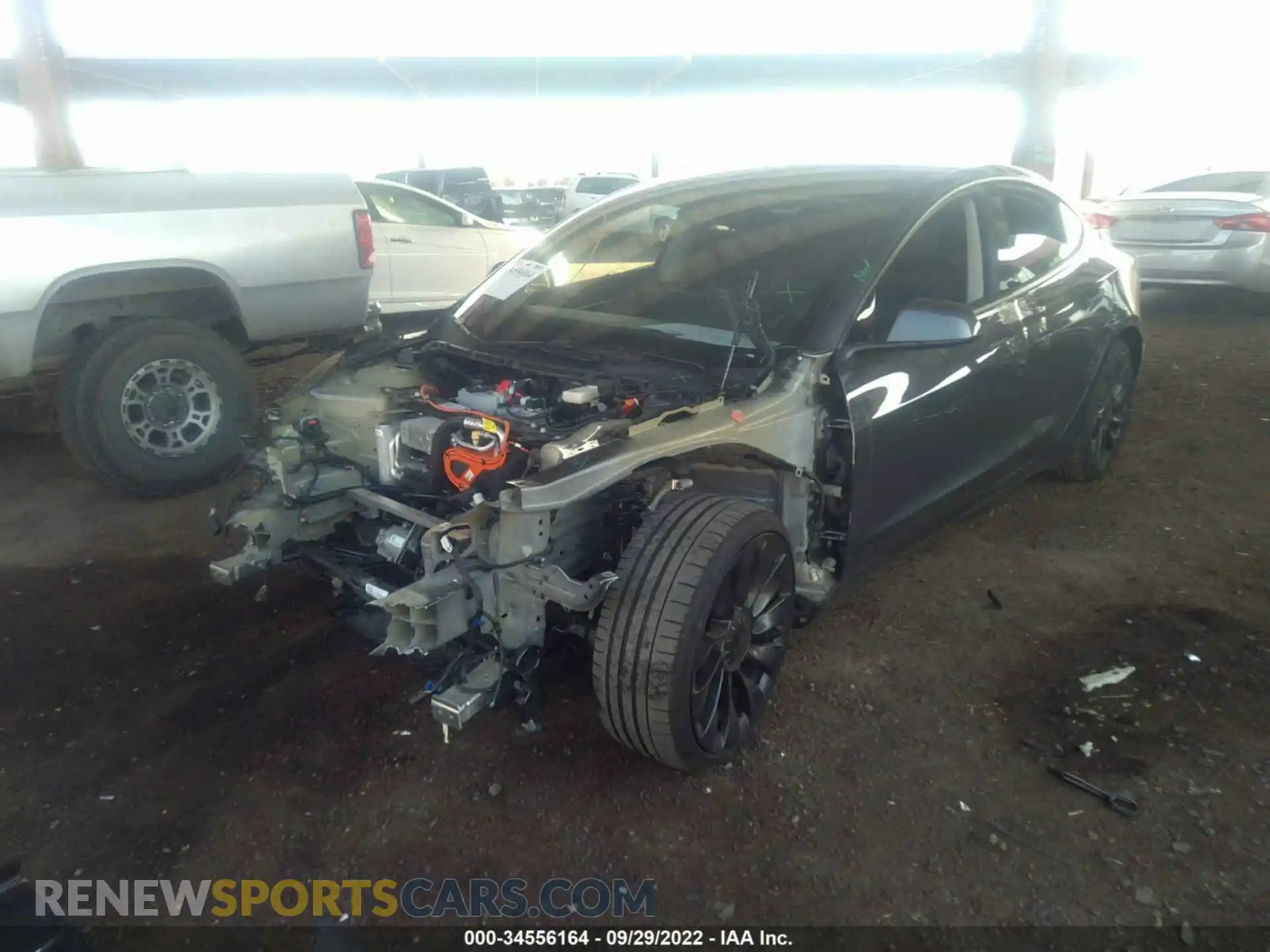 2 fotografías del automóvil dañado 5YJ3E1EC1NF173641 TESLA MODEL 3 2022