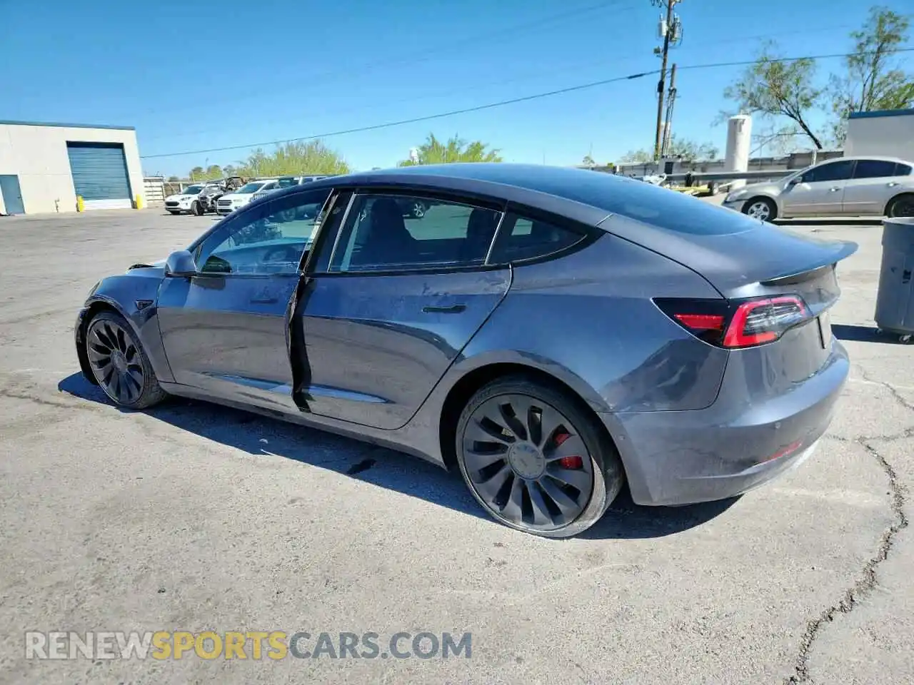 2 fotografías del automóvil dañado 5YJ3E1EC3NF144870 TESLA MODEL 3 2022