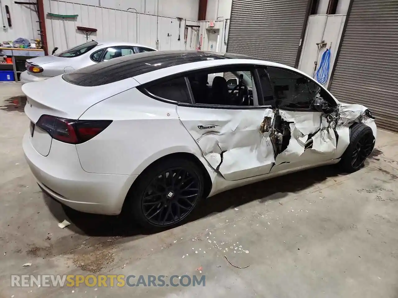 3 Photograph of a damaged car 5YJ3E1EB1PF392609 TESLA MODEL 3 2023