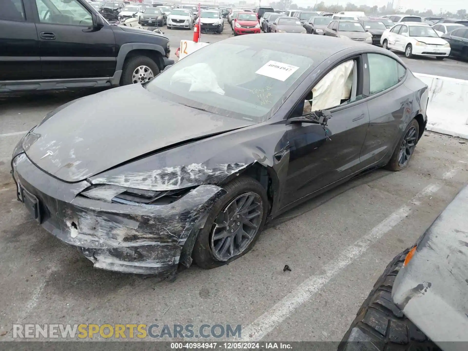 2 fotografías del automóvil dañado 5YJ3E1EB0RF849154 TESLA MODEL 3 2024