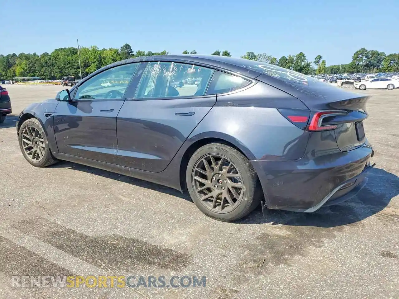 2 fotografías del automóvil dañado 5YJ3E1EBXRF799301 TESLA MODEL 3 2024