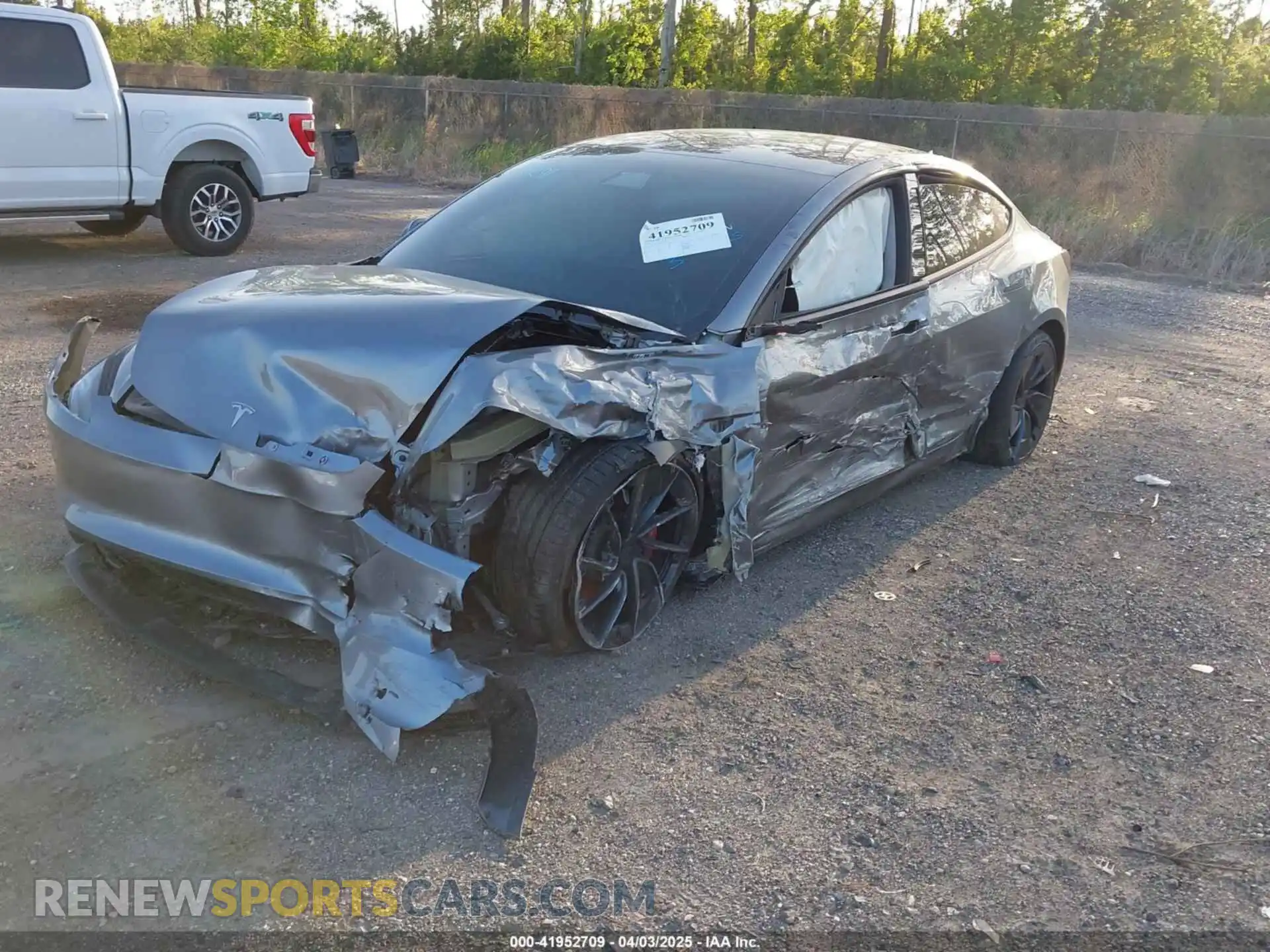 2 Photograph of a damaged car 5YJ3E1ET2RF850850 TESLA MODEL 3 2024