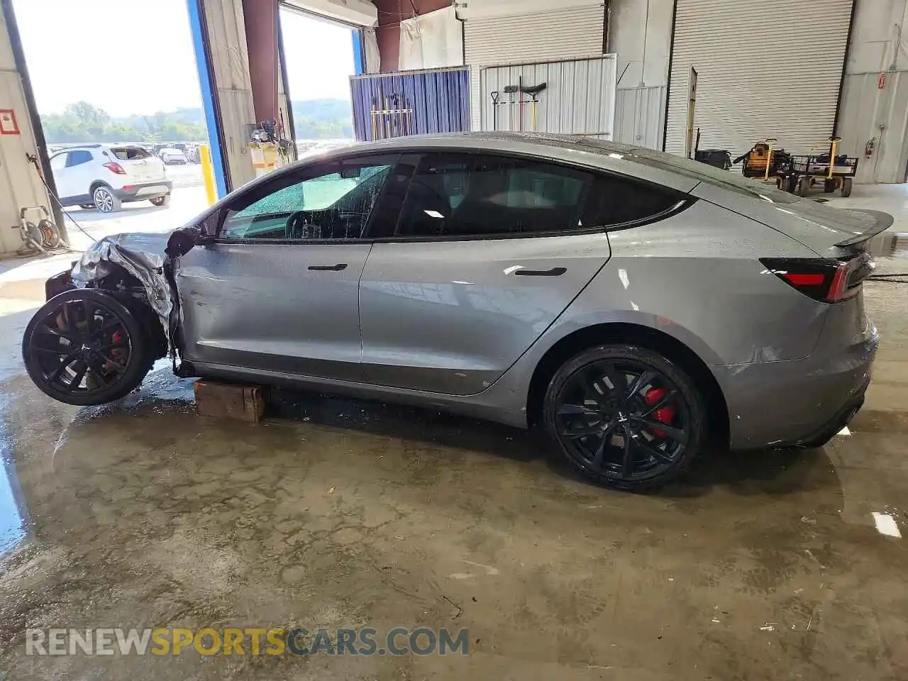 2 Photograph of a damaged car 5YJ3E1ET3RF900770 TESLA MODEL 3 2024