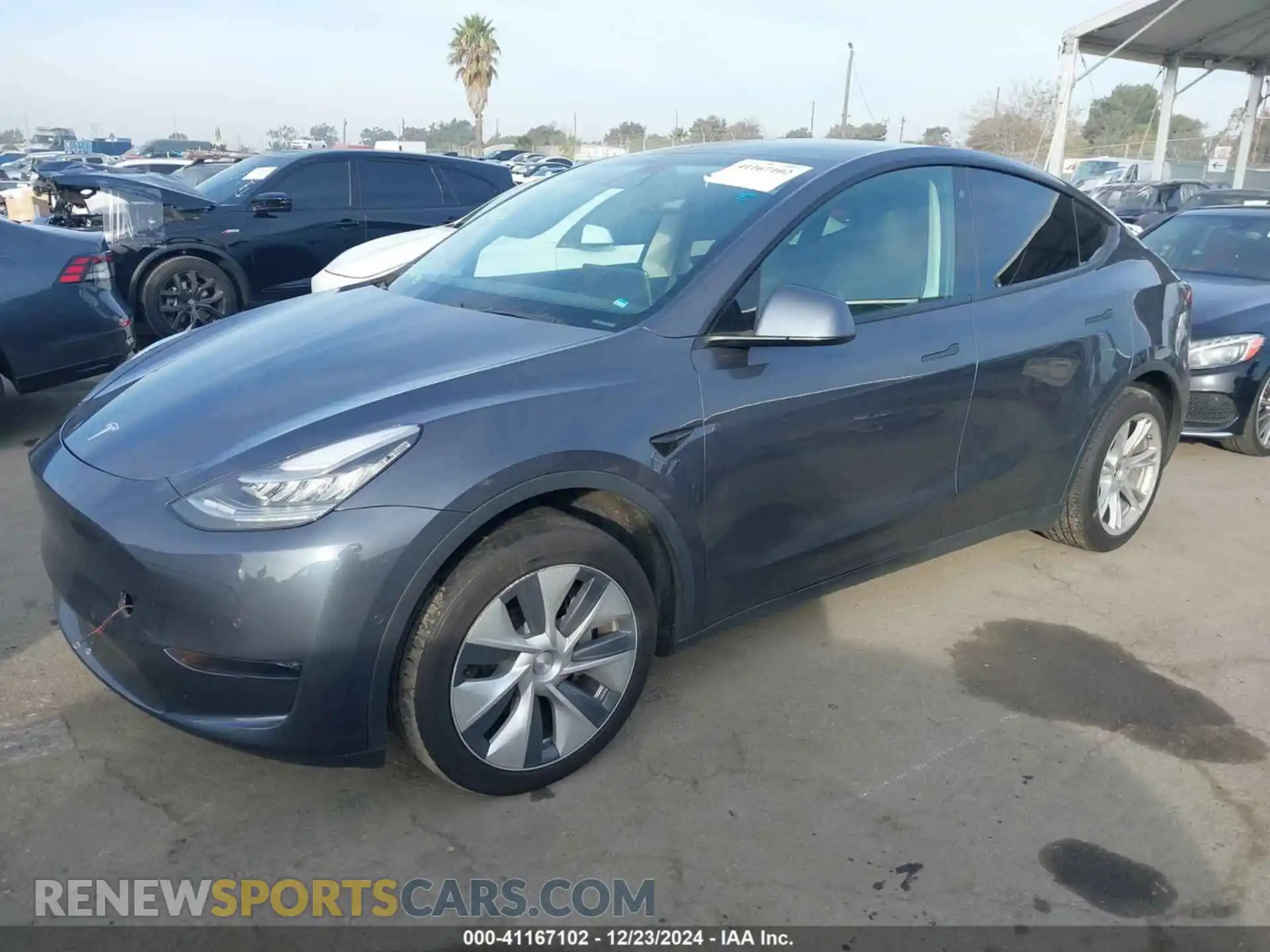 2 fotografías del automóvil dañado 5YJYGDEE4LF014886 TESLA MODEL Y 2020