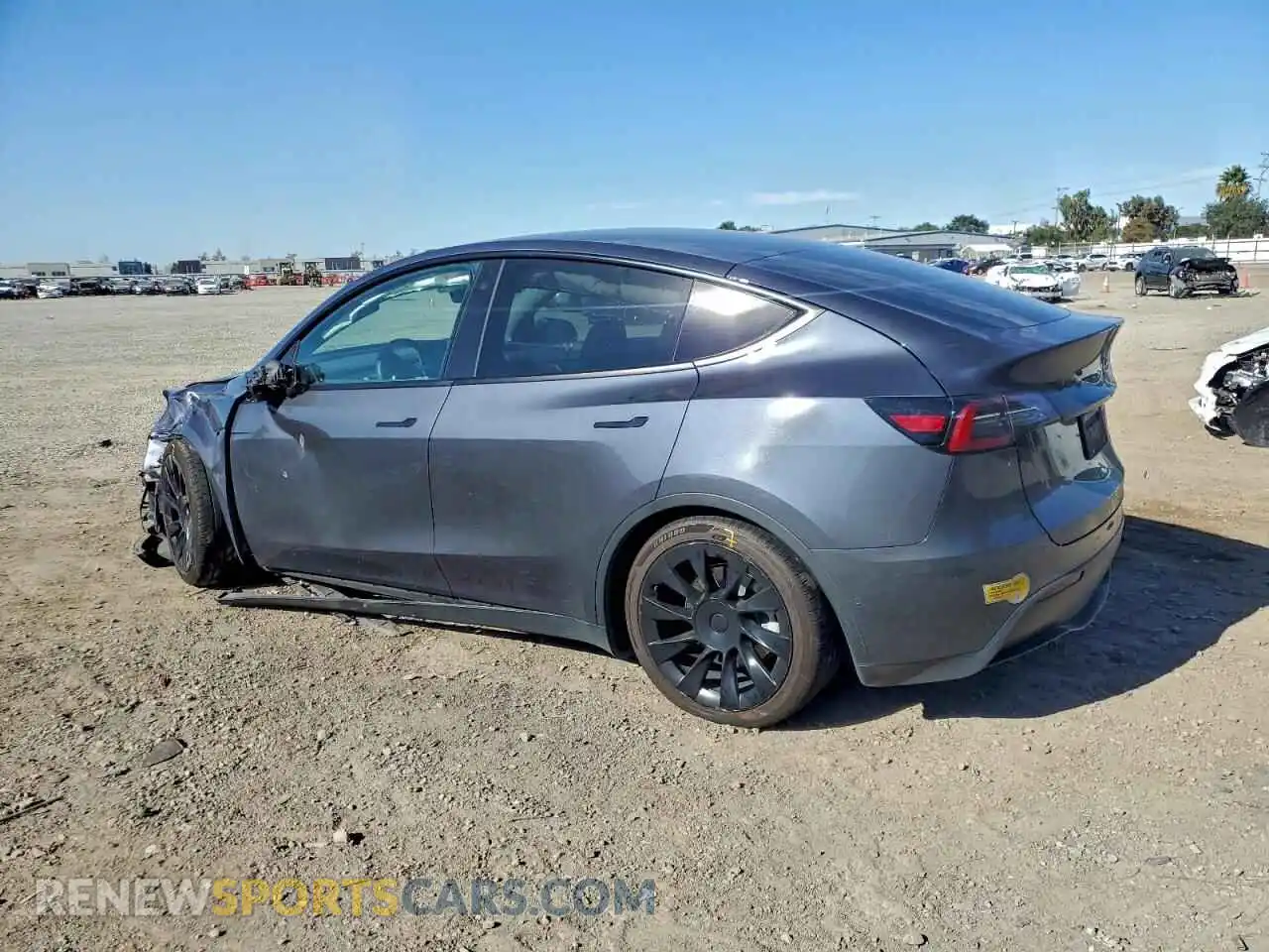 2 fotografías del automóvil dañado 5YJYGAEE4MF269814 TESLA MODEL Y 2021