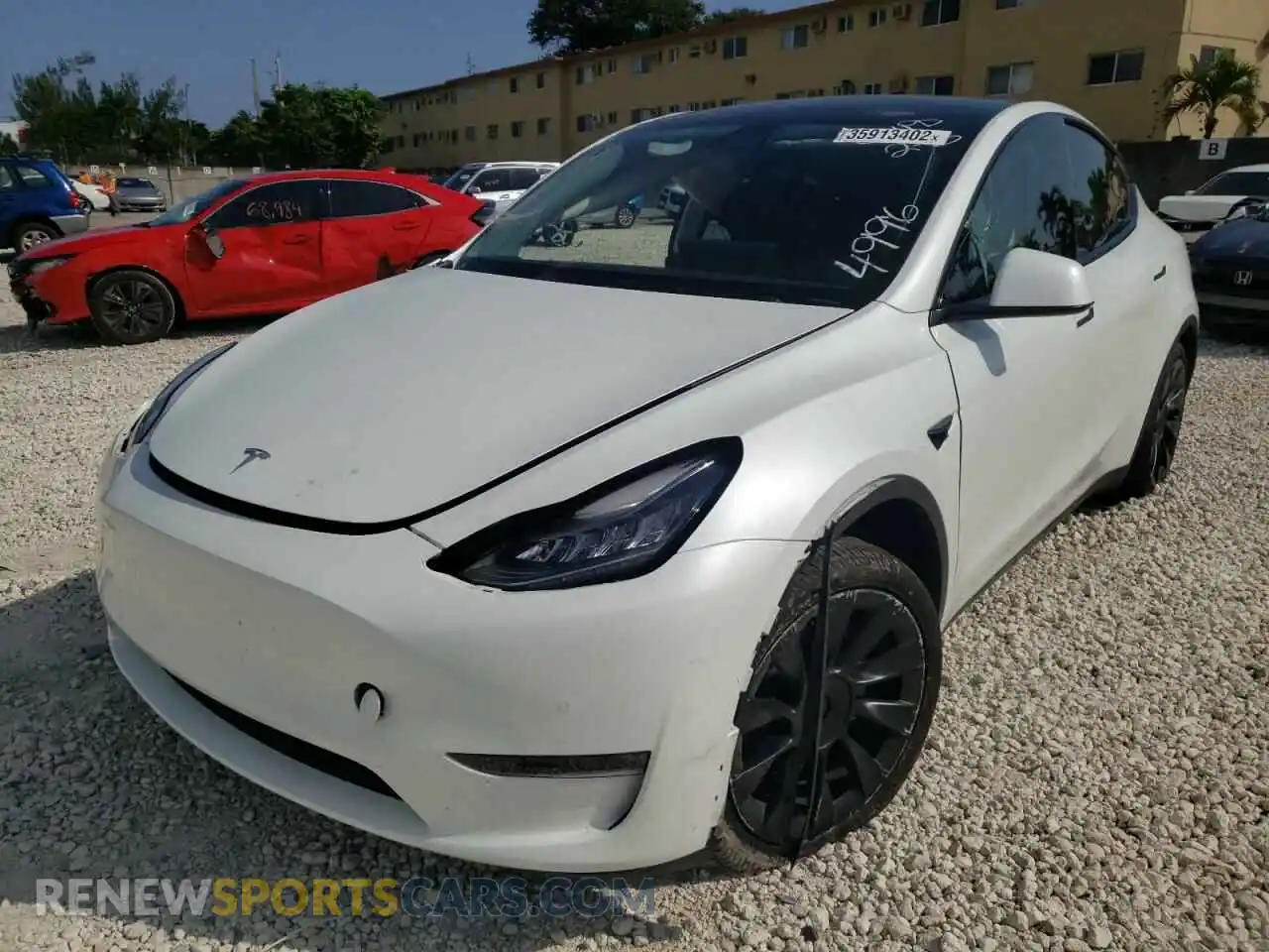 2 fotografías del automóvil dañado 5YJYGDED6MF114996 TESLA MODEL Y 2021