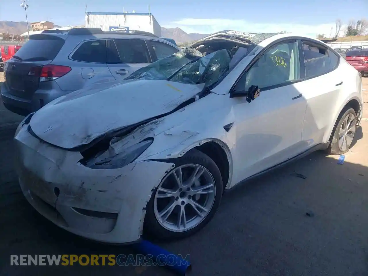 2 fotografías del automóvil dañado 5YJYGDEE0MF069630 TESLA MODEL Y 2021