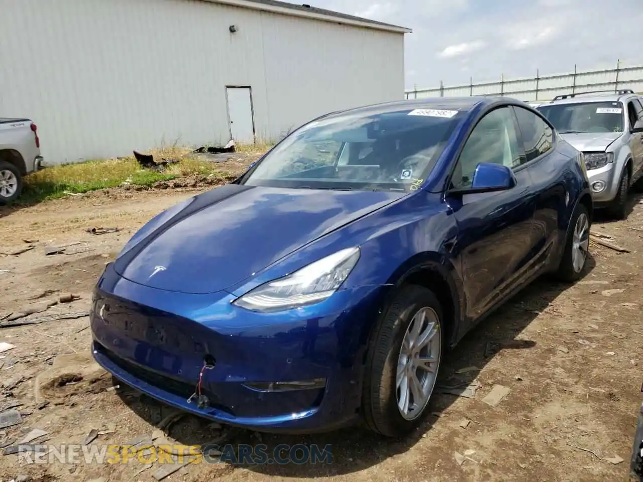 2 fotografías del automóvil dañado 5YJYGDEE0MF082667 TESLA MODEL Y 2021