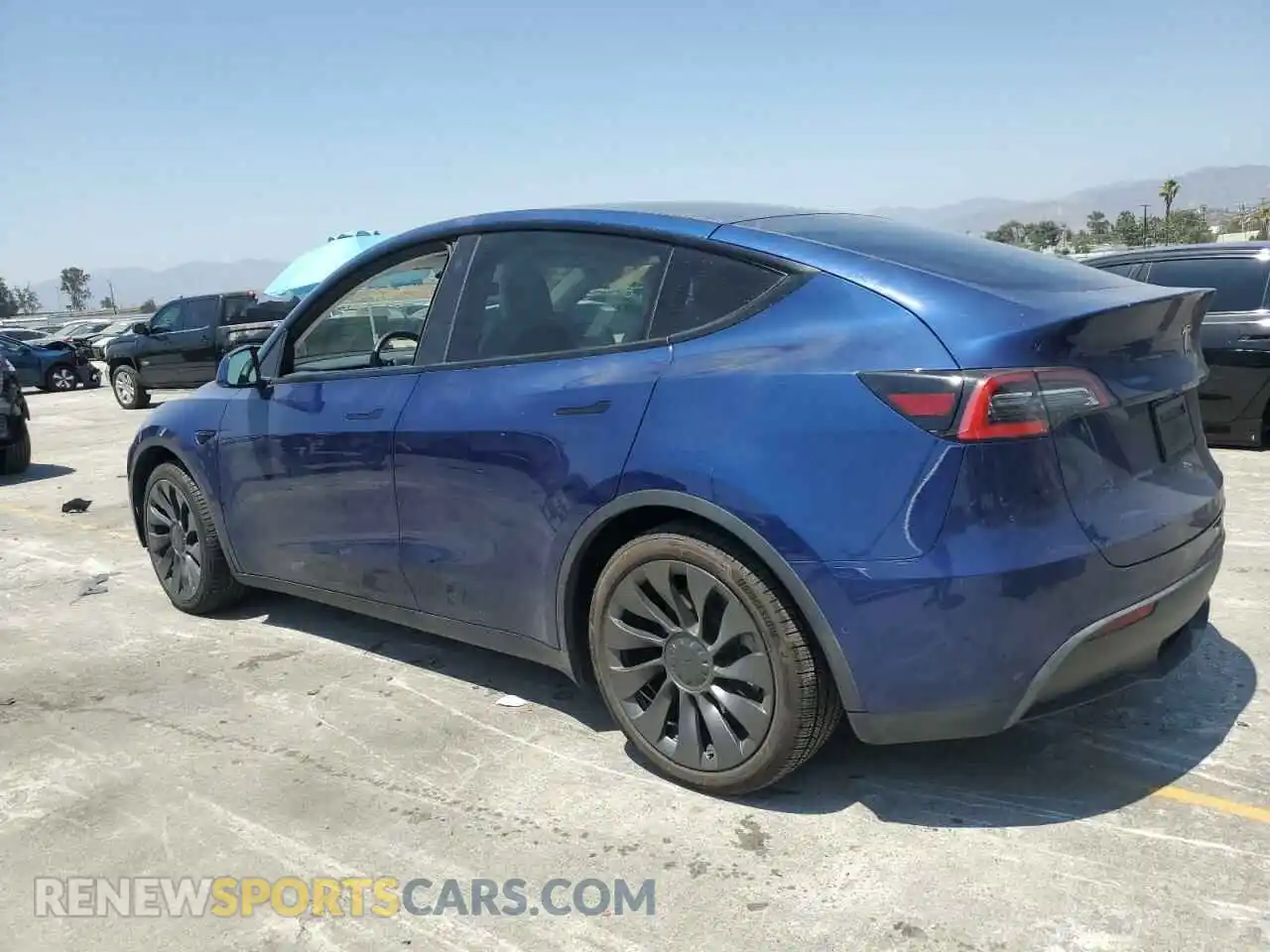 2 fotografías del automóvil dañado 5YJYGDEE0MF099419 TESLA MODEL Y 2021