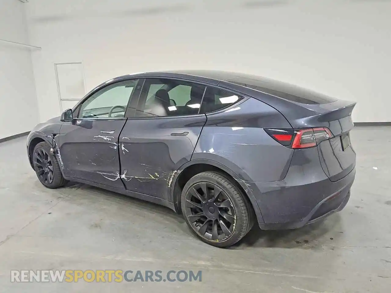 2 fotografías del automóvil dañado 5YJYGDEE2MF199599 TESLA MODEL Y 2021