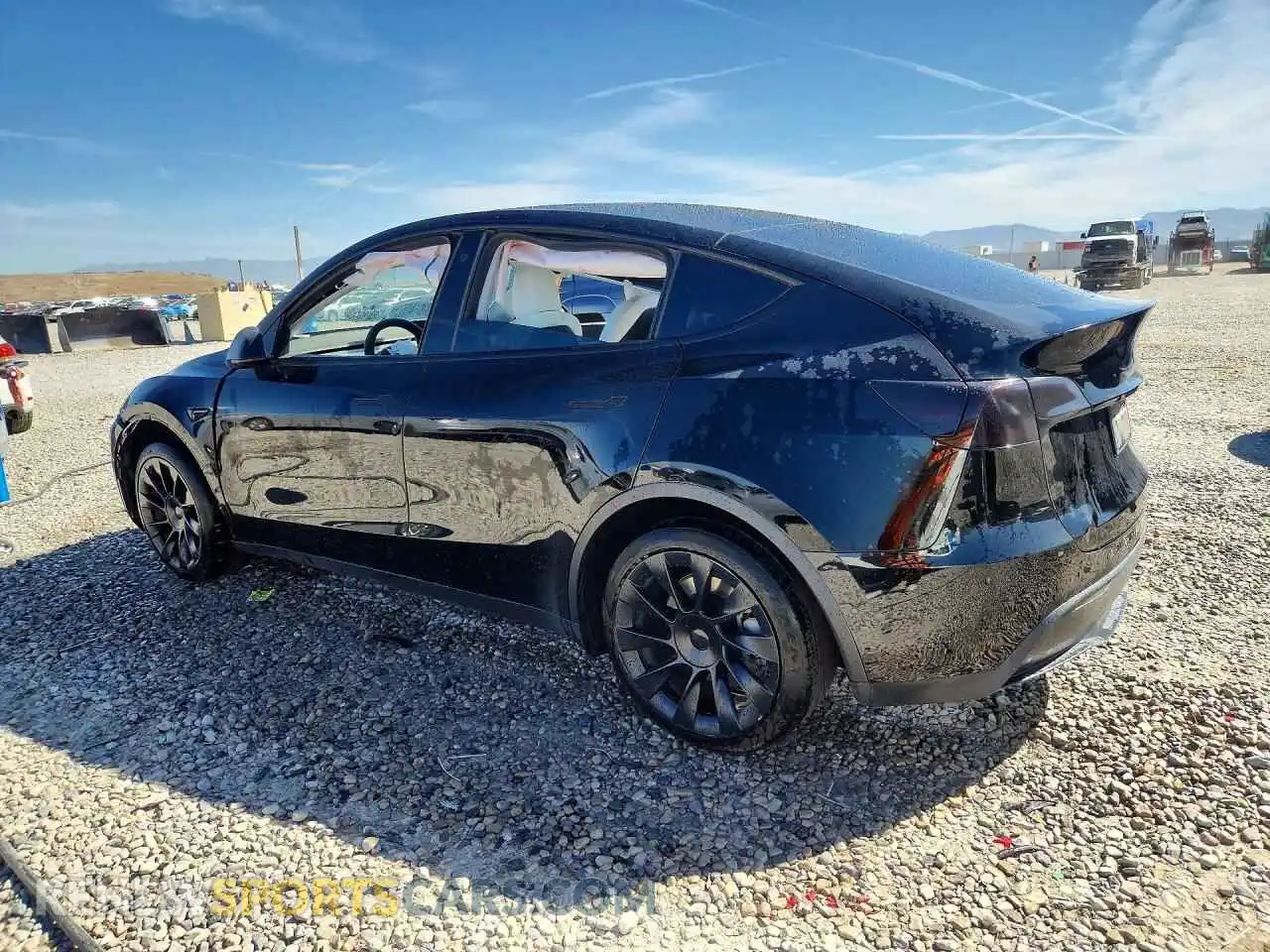 2 fotografías del automóvil dañado 5YJYGDEE3MF217043 TESLA MODEL Y 2021