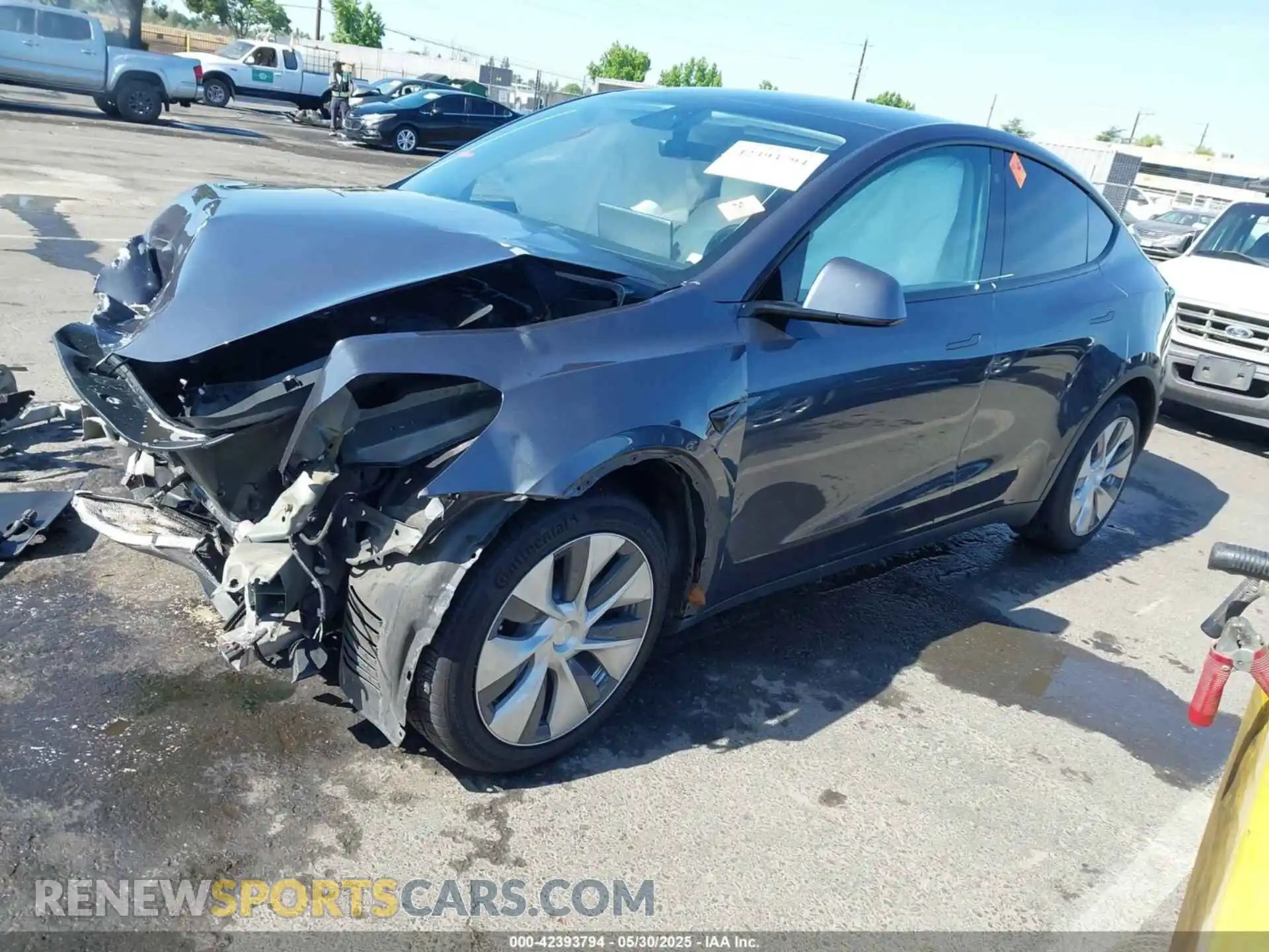 2 fotografías del automóvil dañado 5YJYGDEE5MF066948 TESLA MODEL Y 2021