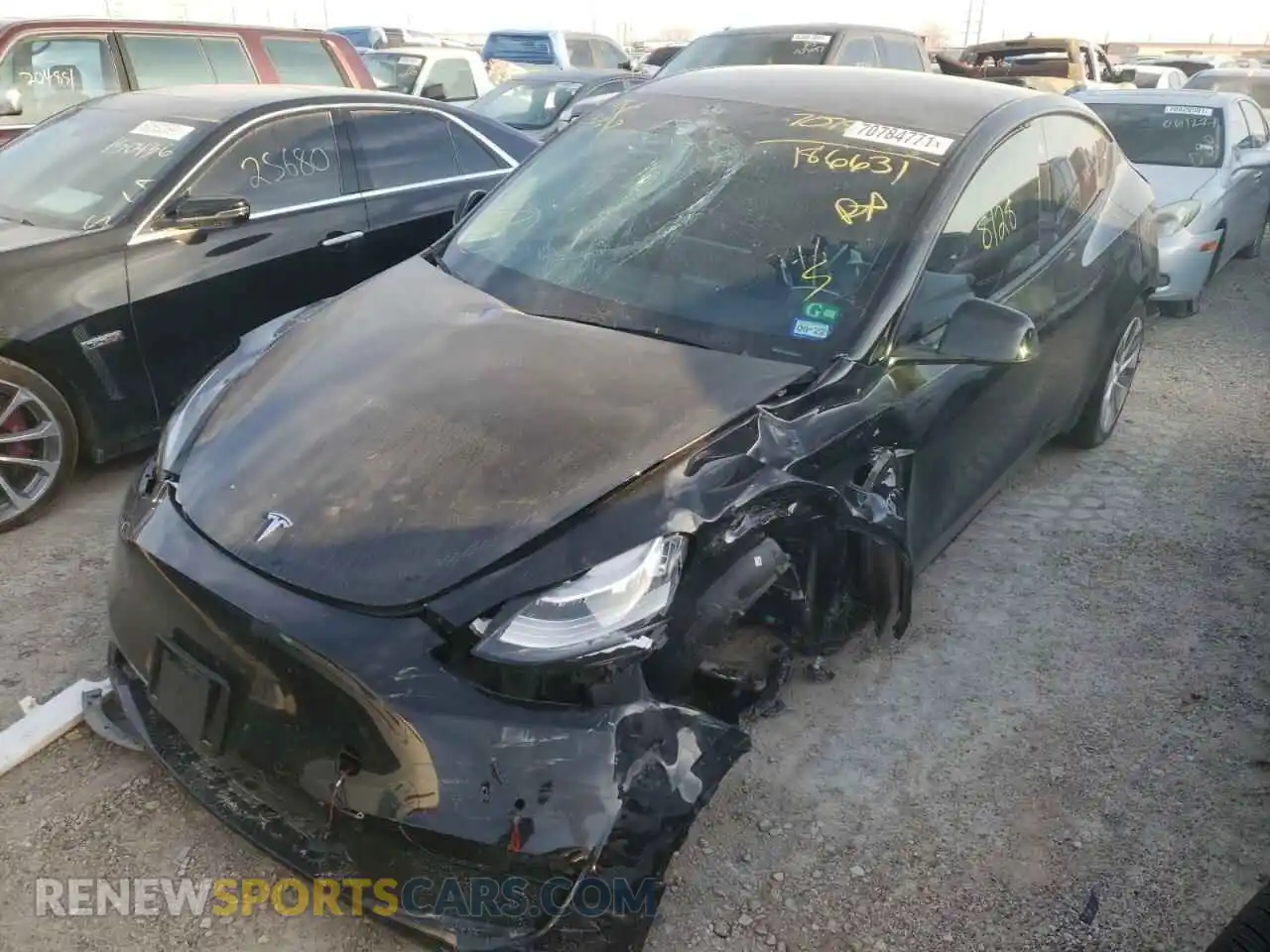 2 fotografías del automóvil dañado 5YJYGDEE6MF186631 TESLA MODEL Y 2021