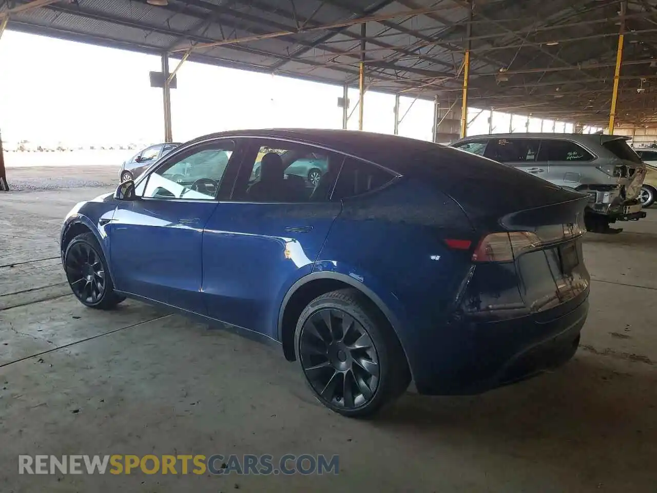 2 fotografías del automóvil dañado 5YJYGDEE7MF278704 TESLA MODEL Y 2021