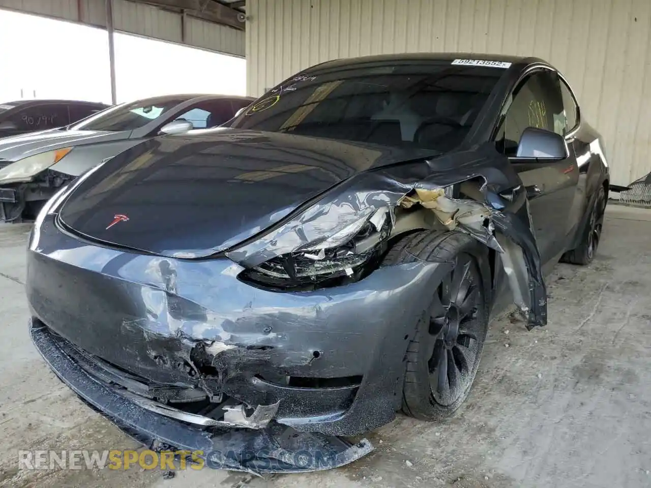 2 fotografías del automóvil dañado 5YJYGDEF2MF194637 TESLA MODEL Y 2021
