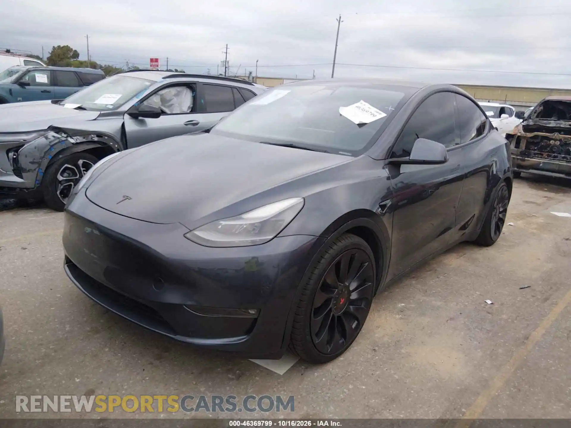 2 fotografías del automóvil dañado 5YJYGDEF3MF173425 TESLA MODEL Y 2021