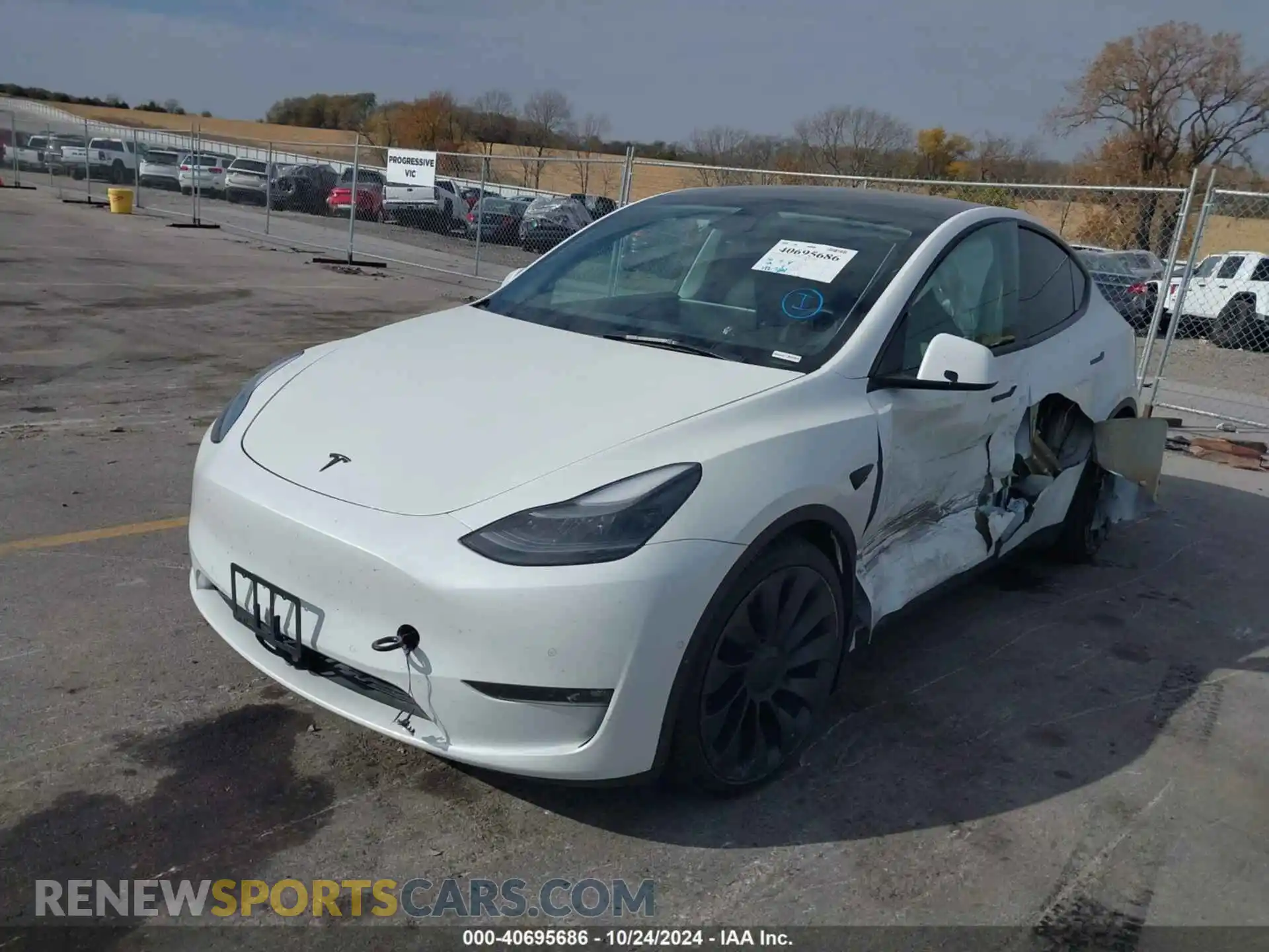 2 fotografías del automóvil dañado 5YJYGDEF8MF303912 TESLA MODEL Y 2021