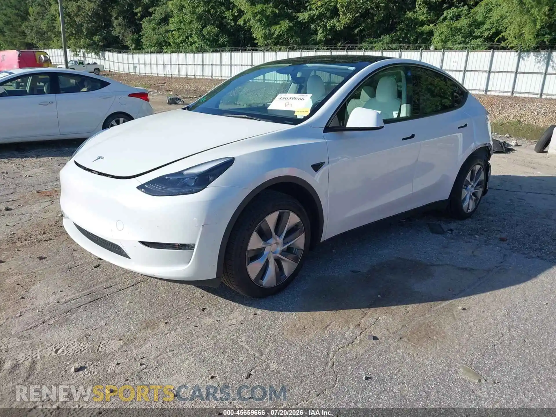 2 fotografías del automóvil dañado 7SAYGDED7PF932311 TESLA MODEL Y 2023