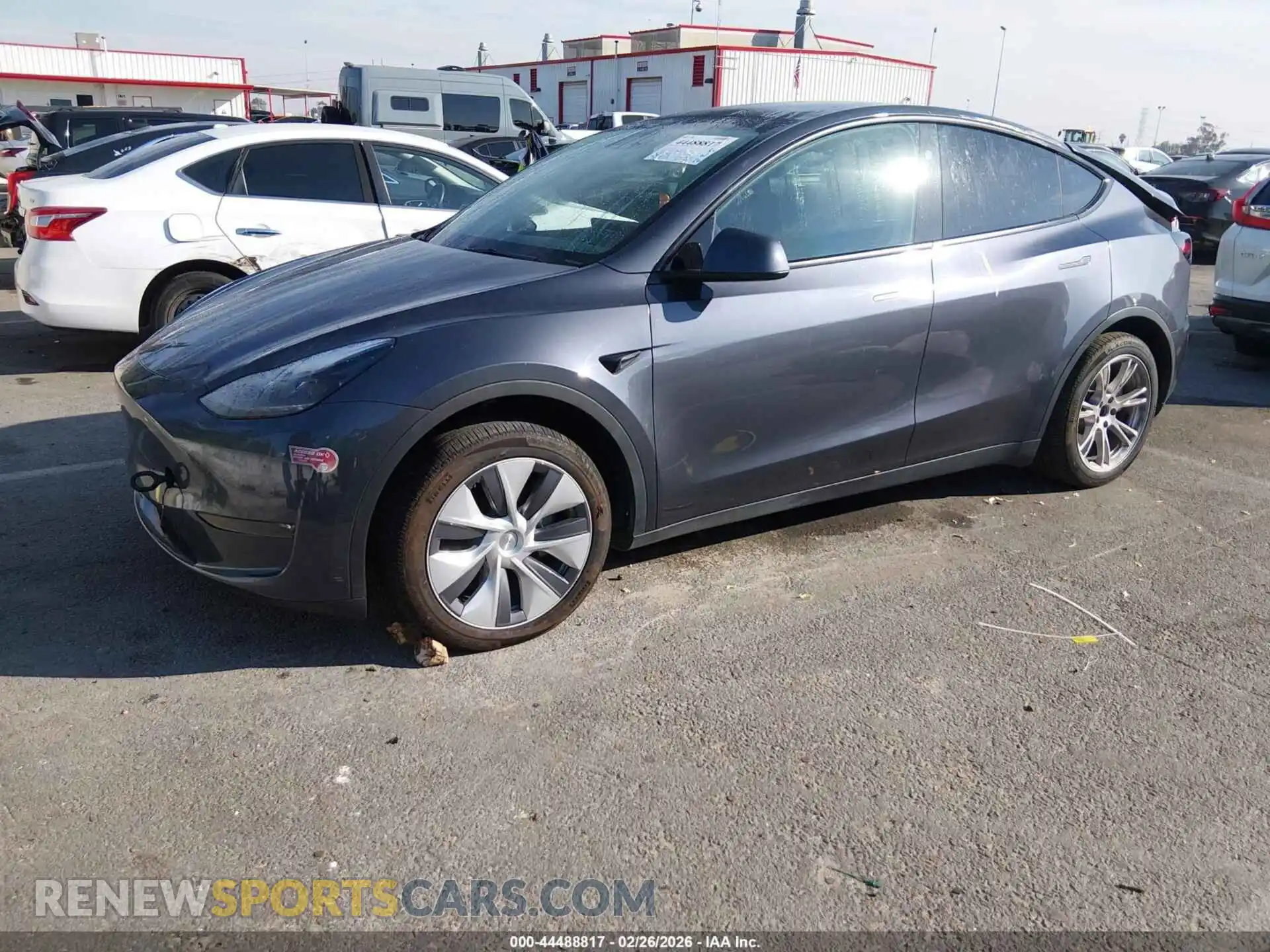 2 fotografías del automóvil dañado 7SAYGDEE5PA211023 TESLA MODEL Y 2023